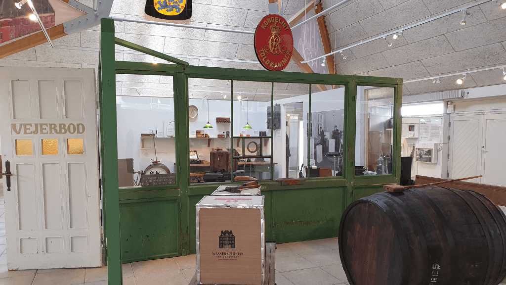 Old customs office with a green window facade